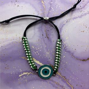Handmade nylon satin adjustable bracelet with evil eye charm